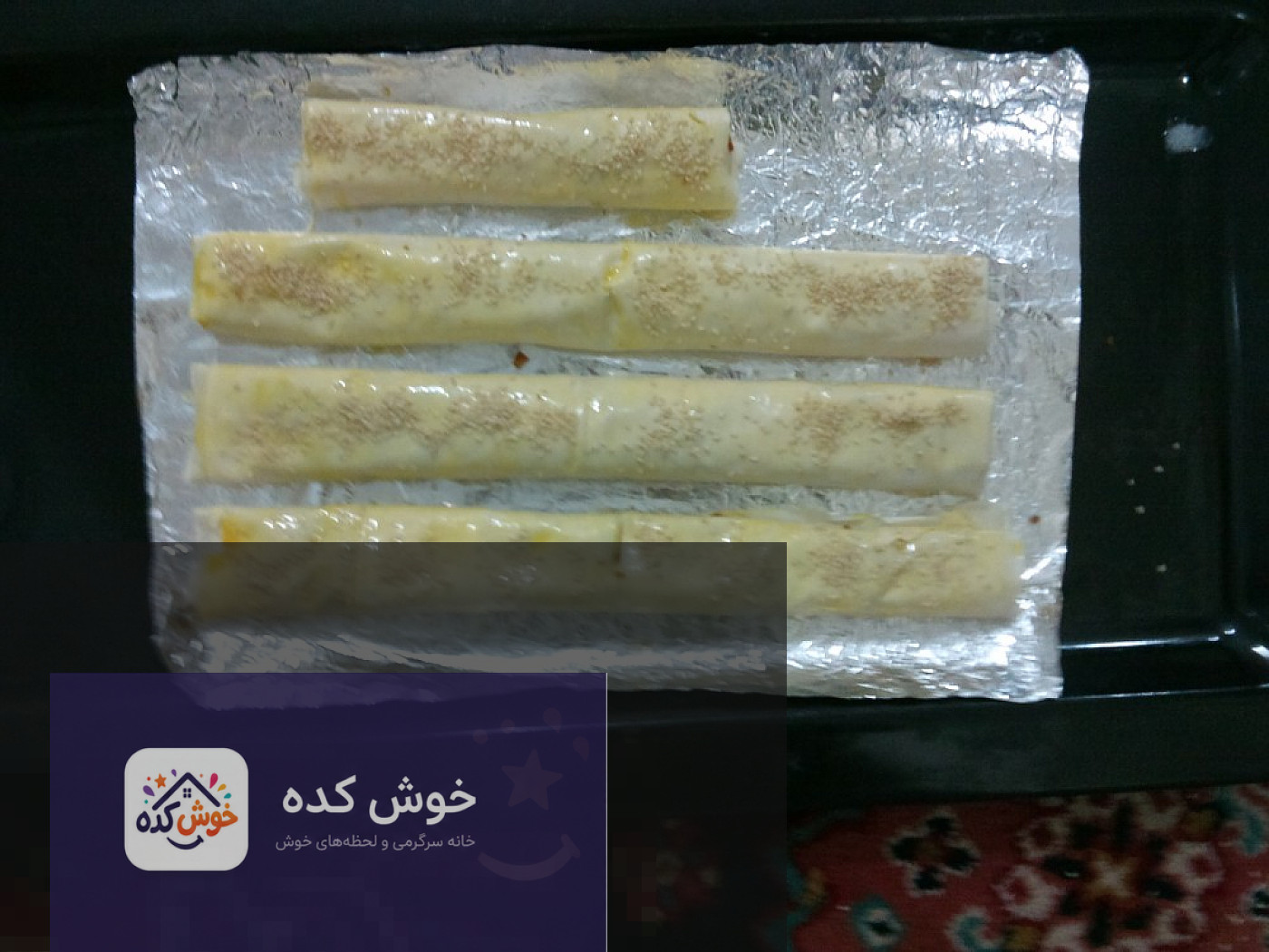 رولت گوشت چرخکرده در خمیر یوفکا رولت گوشت چرخکرده پیچیده شده در خمیر یوفکا، آماده برای قرار گرفتن در فر و پخت