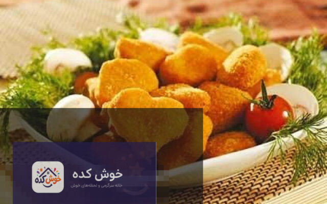 ناگت ماهی خانگی طلایی و ترد در بشقاب، آماده سرو با سس کچاپ