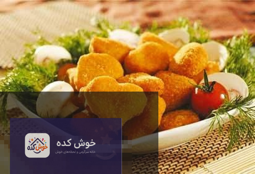 ناگت ماهی خانگی طلایی و ترد در بشقاب، آماده سرو با سس کچاپ